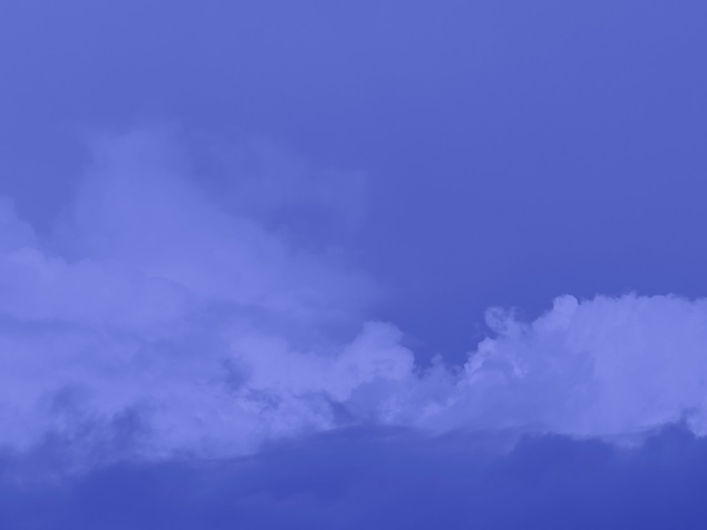 Image showing an blue-colored cloud against a sky.