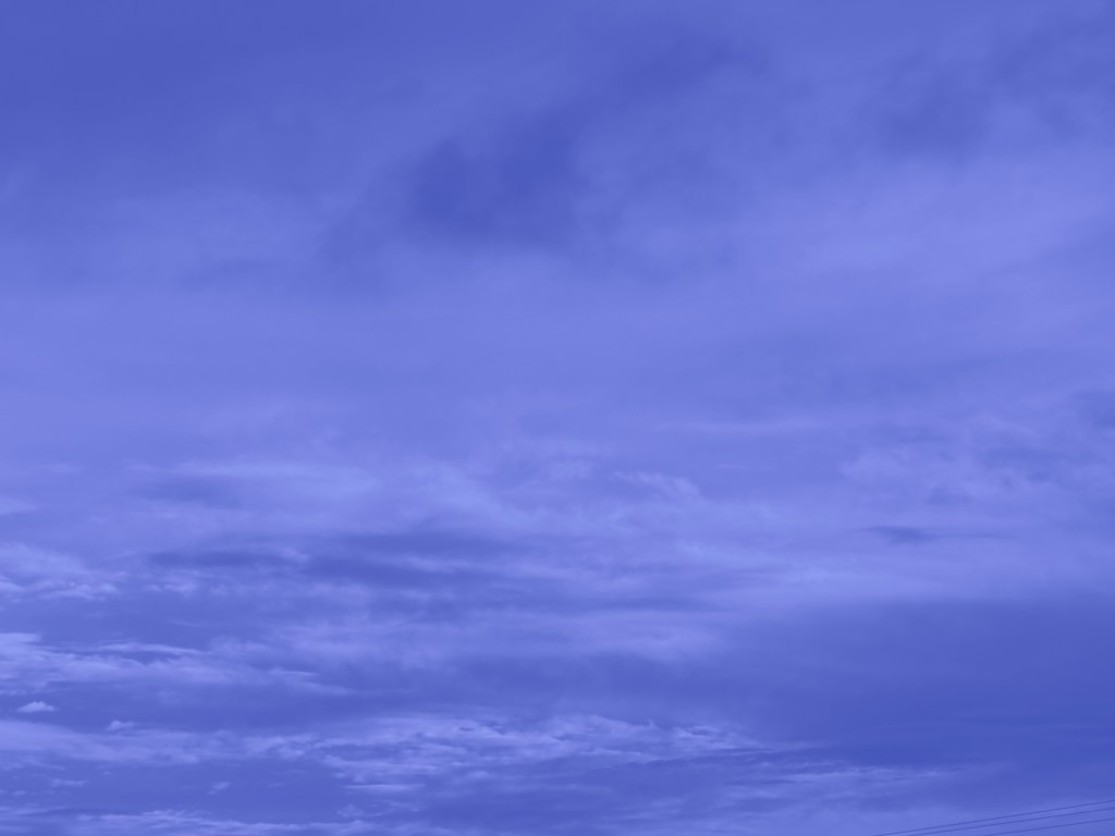 Image showing an blue-colored cloud against a sky.